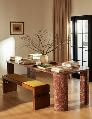 Ramoon wide leg solid marble dining table by Carly Cushnie styled with a bench.