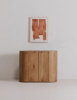 Kono 2-door curved oak cabinet.