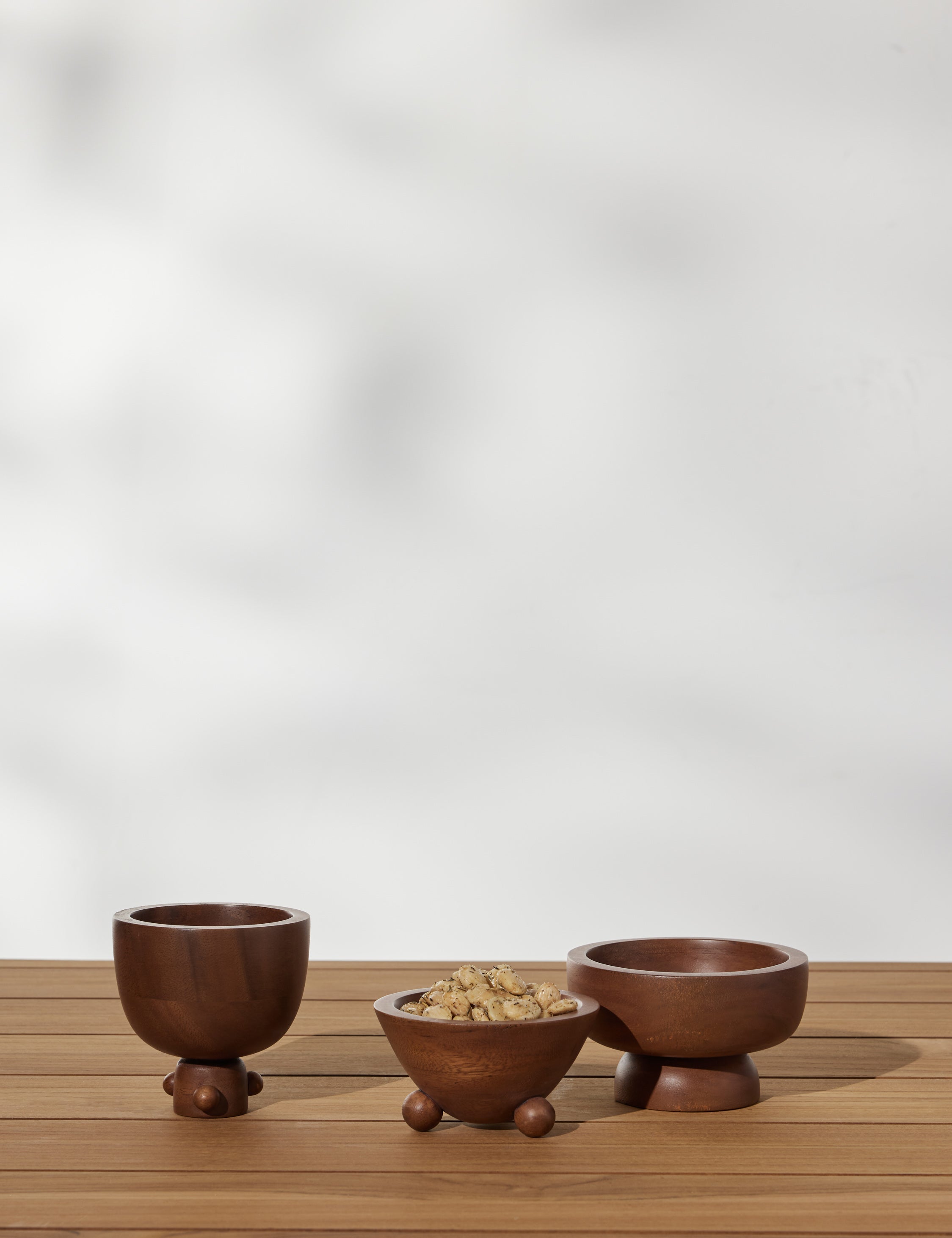 #color::acacia | Set of three mini footed walnut bowls by Sarah Sherman Samuel