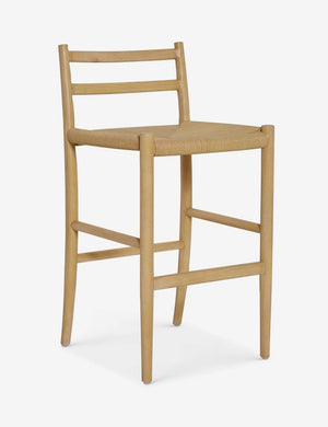 Angled view of the Nicholson slim natural oak wood frame and woven seat counter stool.
