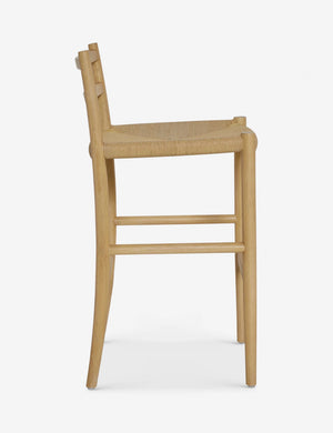Side view of the Nicholson slim natural oak wood frame and woven seat counter stool.