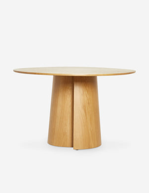Pau oak veneer round dining table with a pedestal base