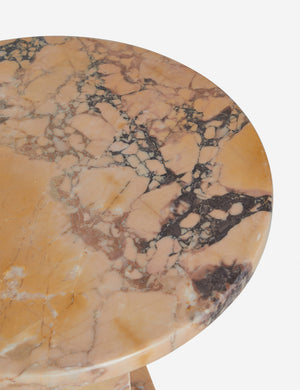 Close up of the Potts round marble pedestal side table.