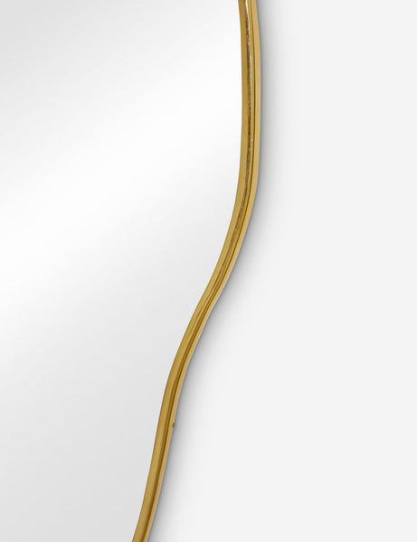 #color::gold #size::large | The gold curved frame on the large puddle mirror