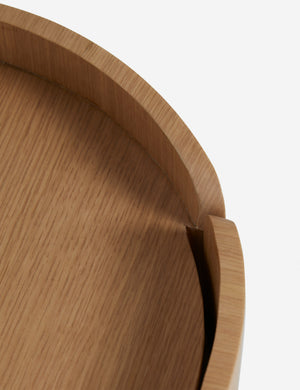 Close up view of the Raphael modern rounded natural wood two drawer nightstand