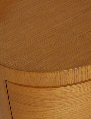 Close up view of the Ripple wavy profile, round two drawer nightstand