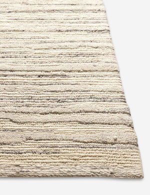 Corner of the Rizzoli gray rug