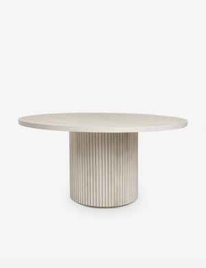 Rutherford white-washed acacia wood round dining table with pedestal base.