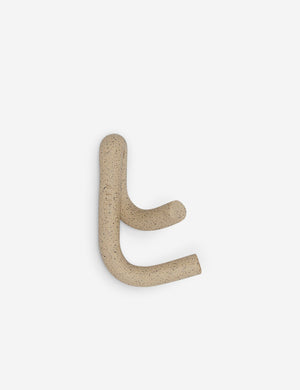 Side view of the Cream speckled Leggy Crossed Wall Hook by SIN Ceramics
