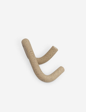 Angled view of the Cream speckled Leggy Crossed Wall Hook by SIN Ceramics