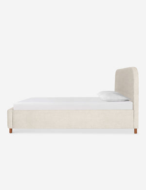 Side of the Solene Boucle Cream platform bed