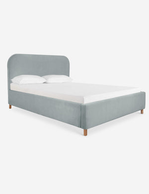 Angled view of the Solene Dove light blue velvet platform bed