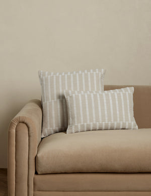 Thisbe offset stripe throw and lumbar pillows paired together on a sofa.
