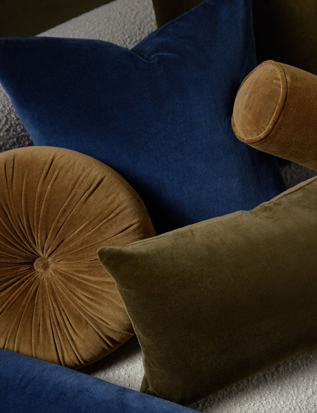 #color::olive #style::lumbar  #fill type::with-feather-down-insert  #fill type::pillow-cover-only |   Charlotte velvet pillow in olive and true blue sit on a cream boucle lounger with other velvet pillows