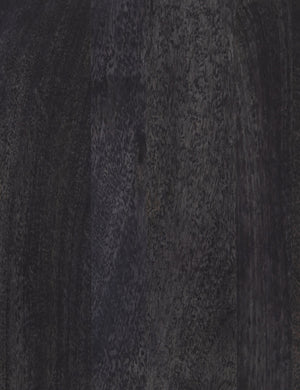 Detailed view of the black mango wood on the Hannah media console with cane doors.