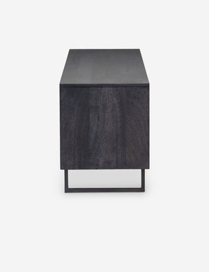 Side view of the Hannah black mango wood media console with cane doors.