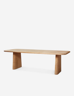 Side view of Mela oak wood dining table.