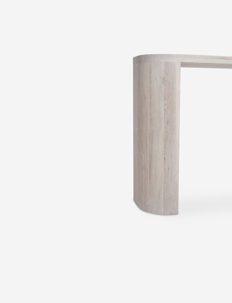#color::washed-oak | Close-up of the leg of the Luna white-washed oak oval console table.