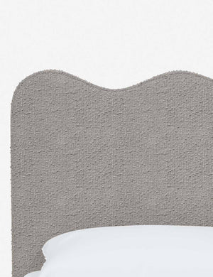 Close-up of the undulating lines on the headboard of the Clementine moonlight boucle platform bed