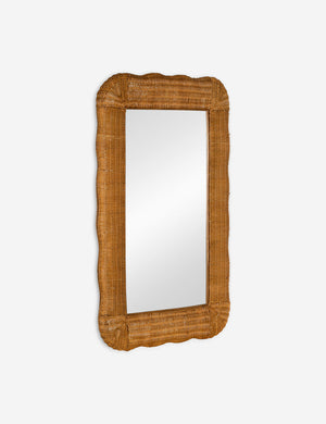Angled view of the Yarely woven rattan frame wall mirror.