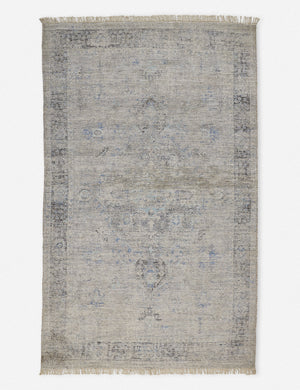 Ismenia distressed slate-toned persian rug with fringed ends
