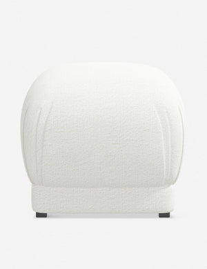 Bailee White Boucle upholstered ottoman with a pouf-like design and pleated corners