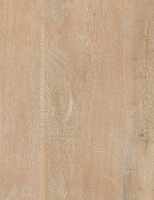 Detailed view of the natural mango wood on the Hannah media console with cane doors.