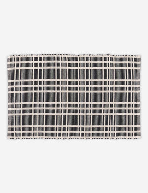 Rika black and white cotton machine washable mat with checkerboard pattern