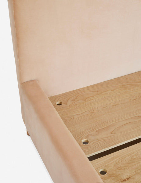 #color::buff #size::queen #size::king #size::cal-king | Close-up of the wooden support beams inside the base of the Solene buff pink velvet platform bed