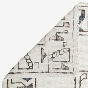 The back-side of the Zehra hand-knotted ivory, gray and purple medallion wool-blend area rug